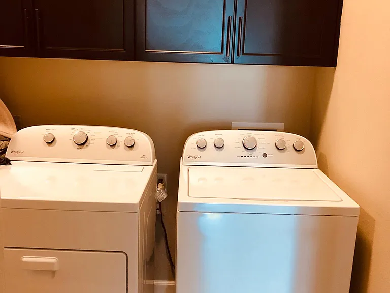 Laundry (Dryer and Washer with Marble counter tops and Cabinets)