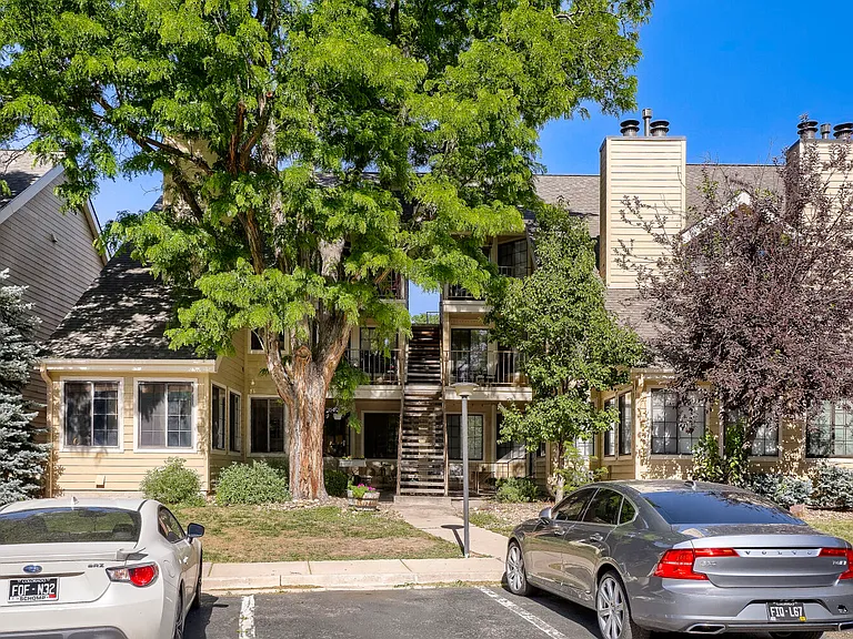 Front Entrance - A welcoming, tree-lined setting surrounded by mature trees, lush landscaping, and the peaceful charm of the established Cedar Pointe community.