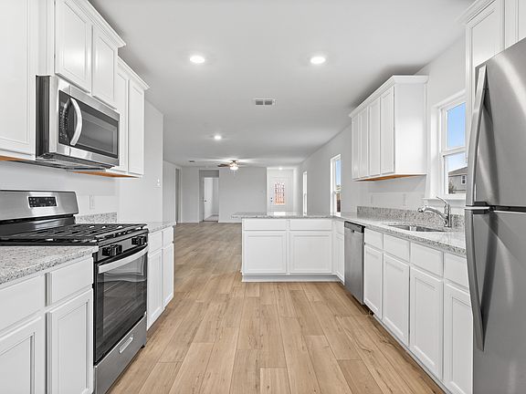 The spacious kitchen is perfect for preparing your family s favorite meals and treats.