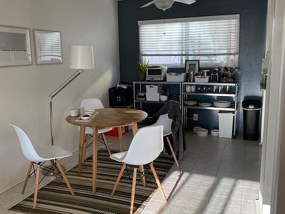 Dining Area, back wall is blue. Much light than picture is showing.