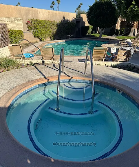 Pool & spa steps from back patio.
