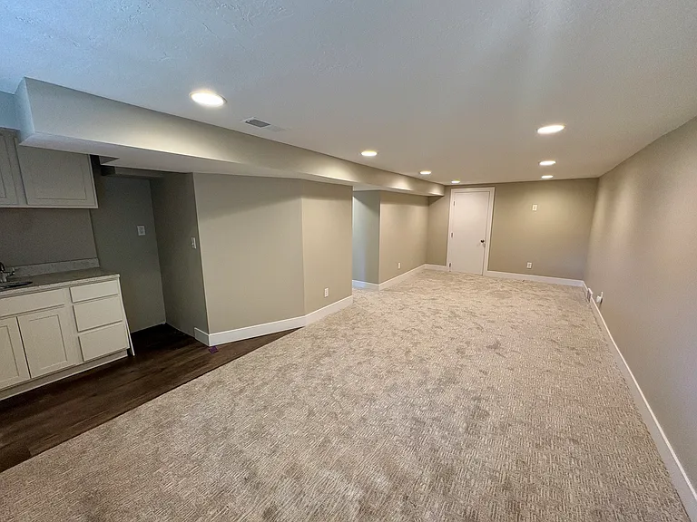 Large basement space with service bar