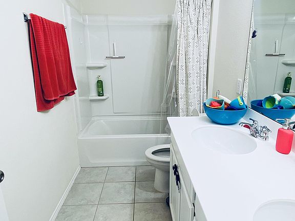 Large shared upstairs bathroom with dual sinks and full tub. Clean & quiet home.