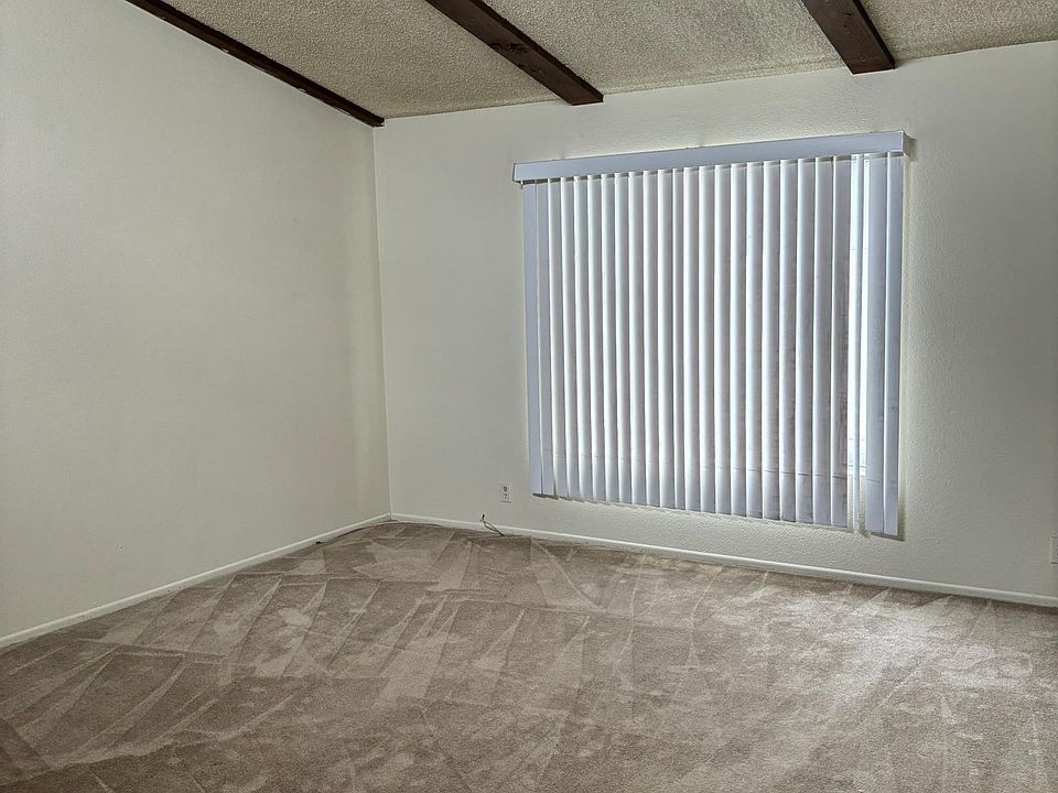 Living room with high beam ceiling