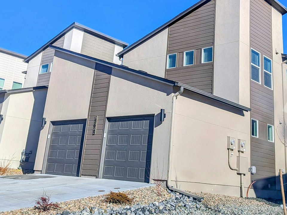 Outside front view with private garage shown on left.