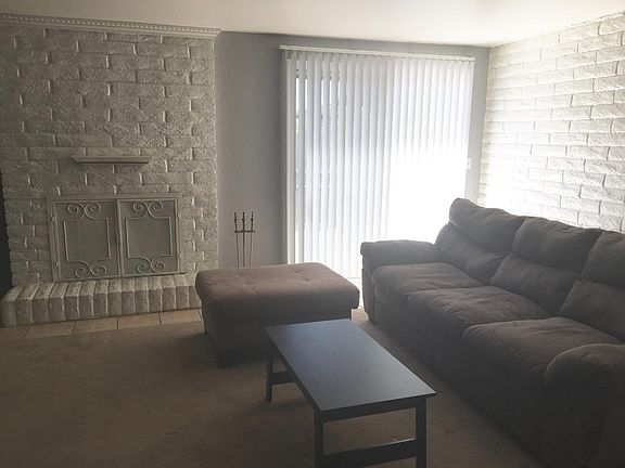 Living Room with couch ottoman and coffee table.