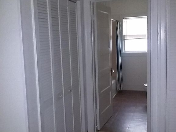 Looking from Bedroom, past one of the closets, into the bathroom