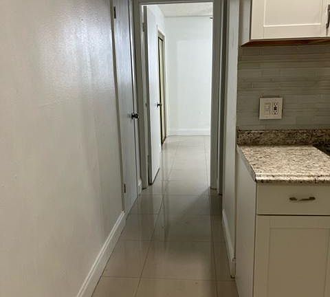 Hallway closet across from bathroom