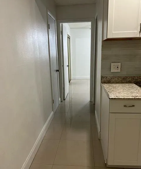 Hallway closet across from bathroom