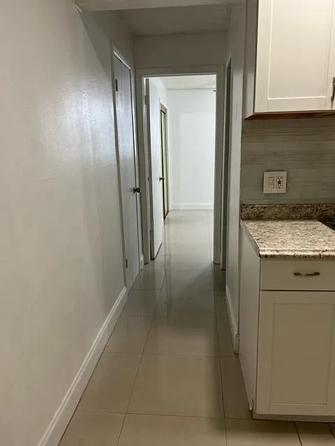 Hallway closet across from bathroom