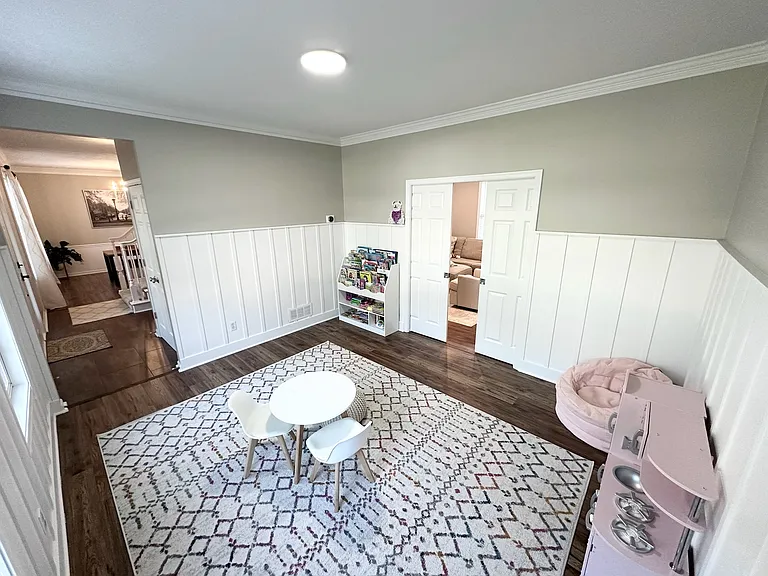 Main floor office / kids play area with pocket doors