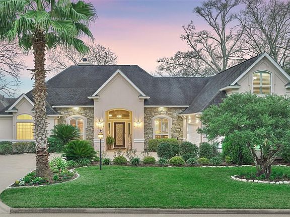 Upgraded plush green landscaping & outdoor lighting greet you upon arrival.