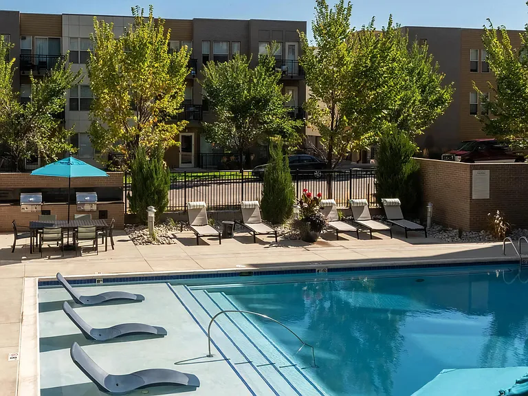 Gated Pool Area with Lounge Chairs and Grill Stations