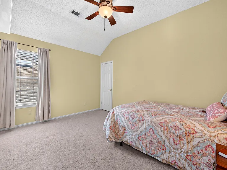 Bedroom with walk-in closet, connects to full bath making it ideal for a guest room