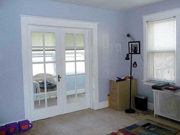 Back bedroom with sun room and french doors