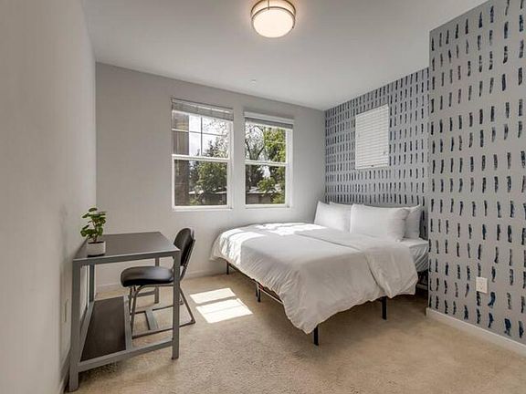 Catch some 'zzz's! This room has a king size bed with a desk and chair.