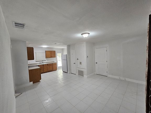 Pantry is next to refrigerator