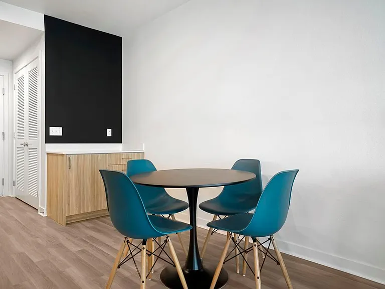 Furnished+ apartment homes include a dining set (Representative Image exact items and style of furnishings may vary)