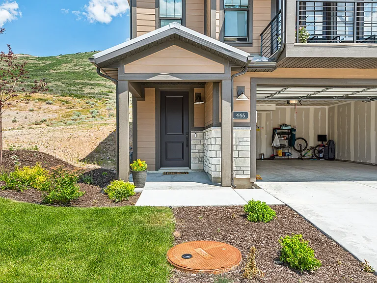 front door with keyless entry and security camera