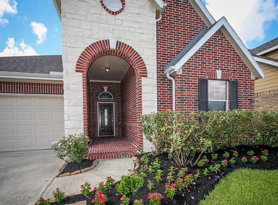 Long entry way on the front porch. Two car garage. Beautiful land scaping with mulched yard.