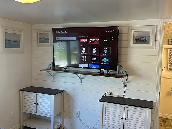 60" flat screen Ruku tv fully furnished pots pans silverware Plates, cups, and glasses, couch has pull out bed