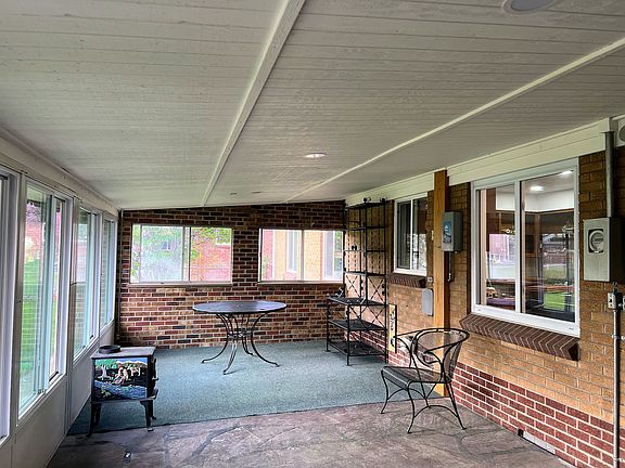 Inside of patio, backs to eat in Kitchen