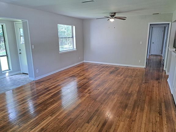 Living/Dining Room. Beautiful refinished real wood floors throughout.