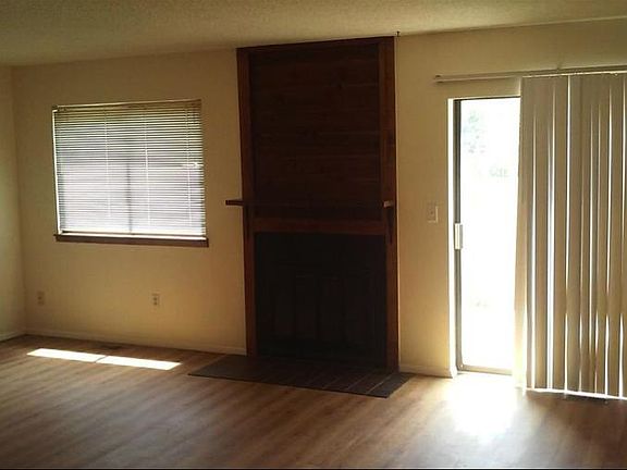 Fireplace & laminate floors in main living area