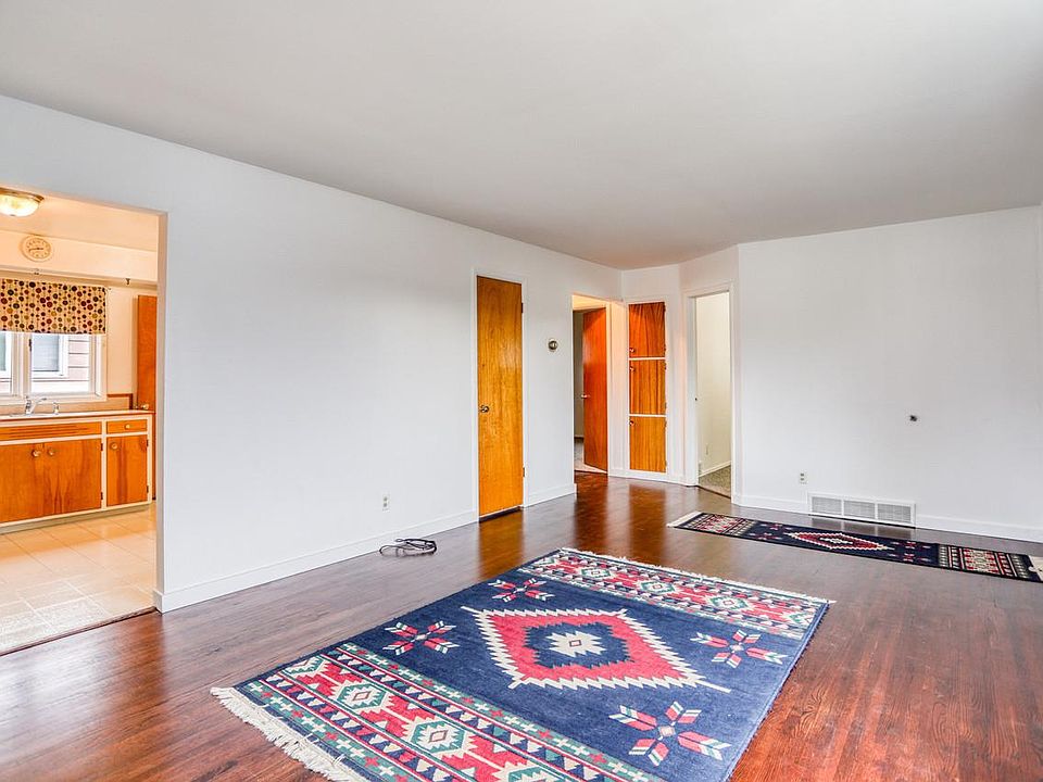 Large living room with newly refinished solid oak hardwood floors