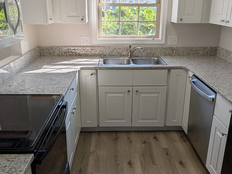 Modern kitchen with oven/range, dishwasher, microwave, refrigerator/icemaker
