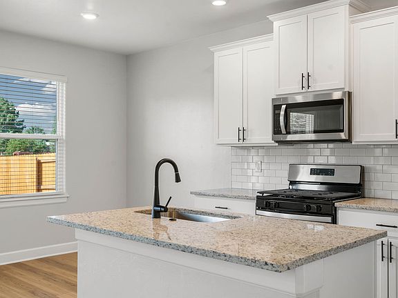 The dining area sits right next to the kitchen.