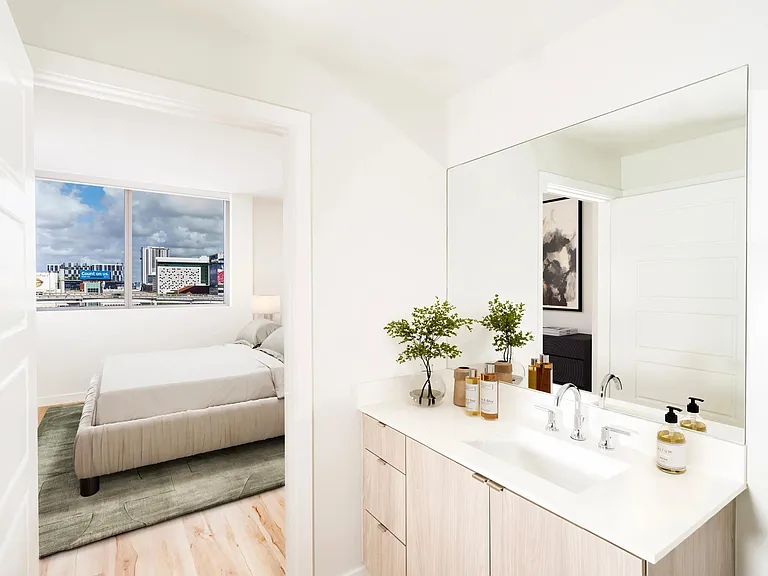 Designer bathrooms with quartz countertops and custom cabinetry.