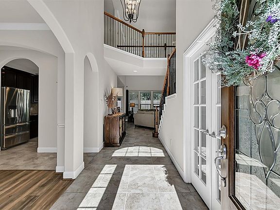 Wide foyer draws you into the heart of the home.