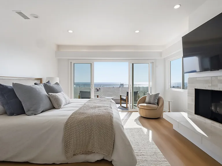 Primary bedroom features a covered balcony, fireplace, large spa bathroom, and incredibly spacious walk-in closet.