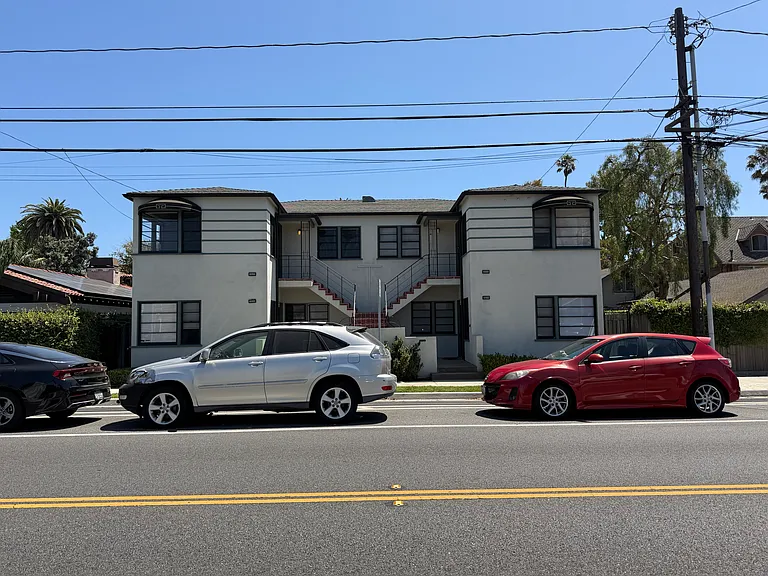 Front of building. The apartment is the left upper