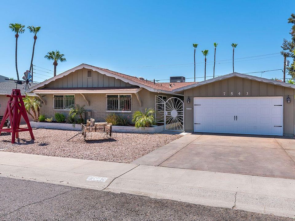 Inviting front of home with 2 car garage and ample parking.