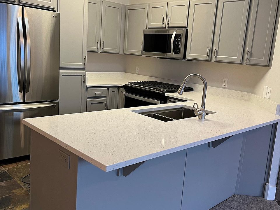 All new kitchen counters, appliances, fixtures, eat in bar