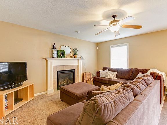 The family room is open to the kitchen and has a beautiful fireplace!!