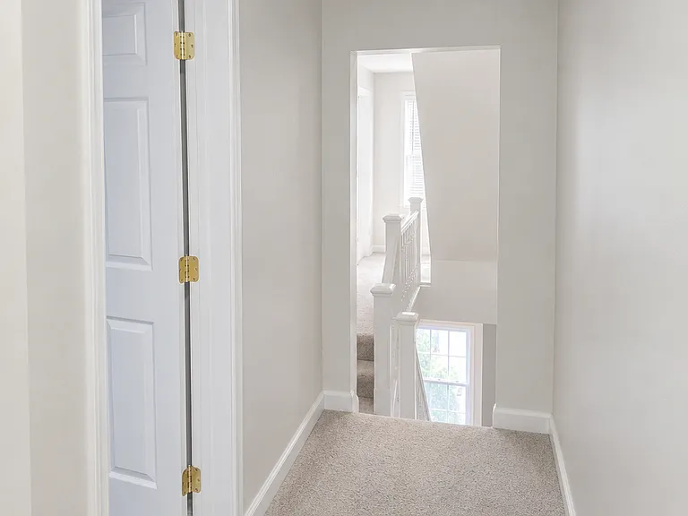 Bright hallway with stairwell view