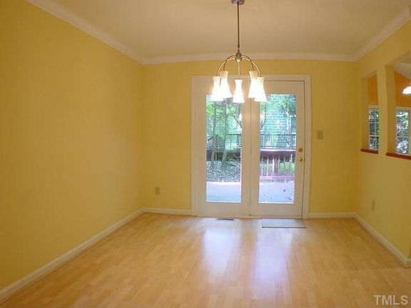 Dining Room, with glass-panelled French doors that open to the deck.