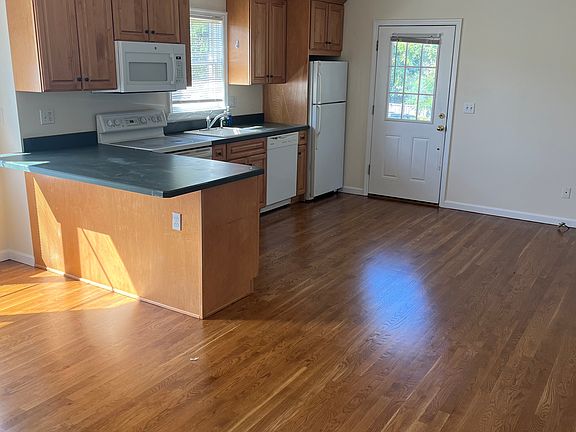 alternate view of kitchen and entrance