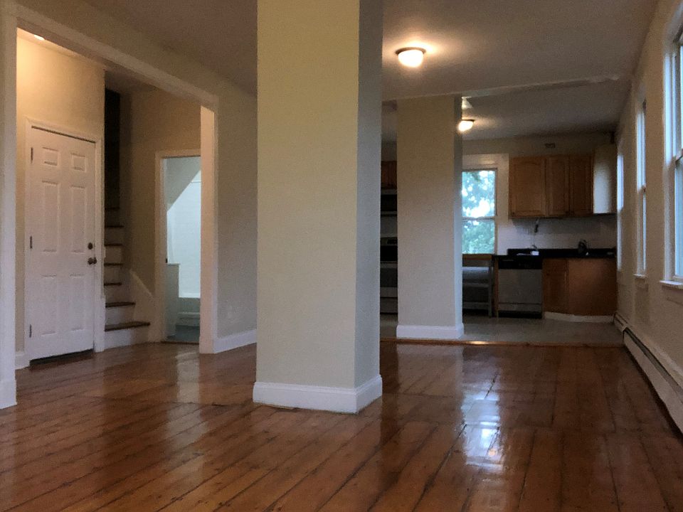 View from one corner of the living room of the living room and kitchen.
