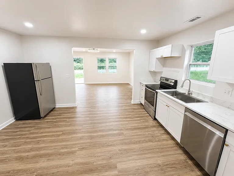 Kitchen with all appliances included - looking towards front of the house
