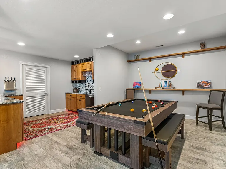 Basement Game Area

Challenge you friends to a game of pool! There's also ping pong, foosball and air hockey!