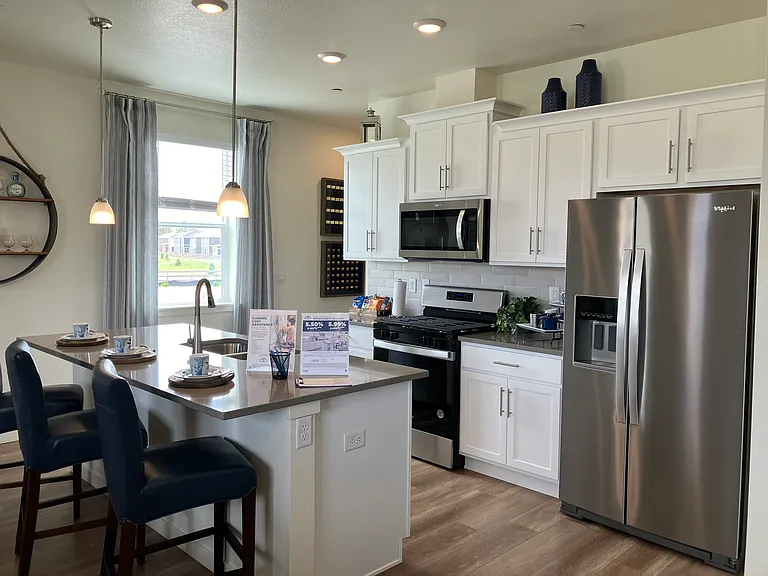 Sample of same floor plan, different finishes, staged with furniture.
