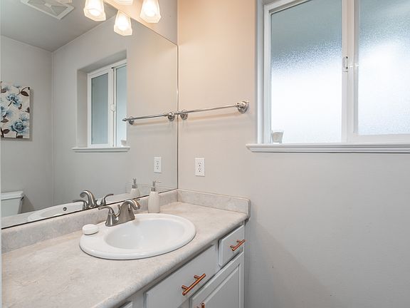 Half bath located by front entrance.