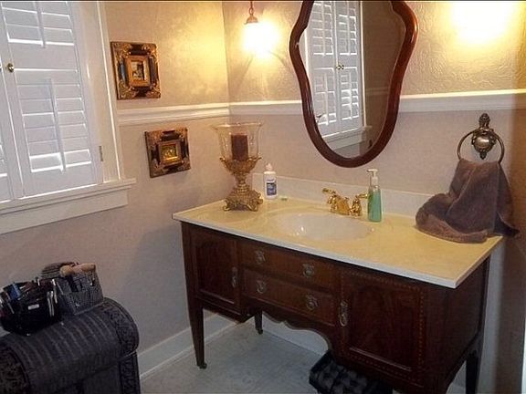 Antique vanity in both BR