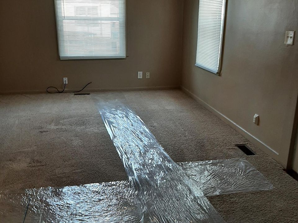 Living room, from edge of dining room (plastic is for carpet protection)