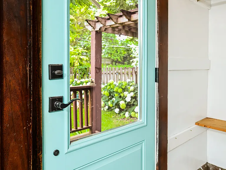 Entrance to backyard and private parking lot.