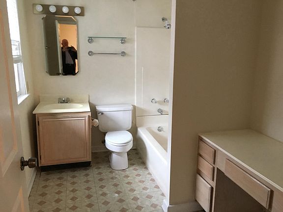 Bathroom - Tub/Shower with a sink, plus vanity